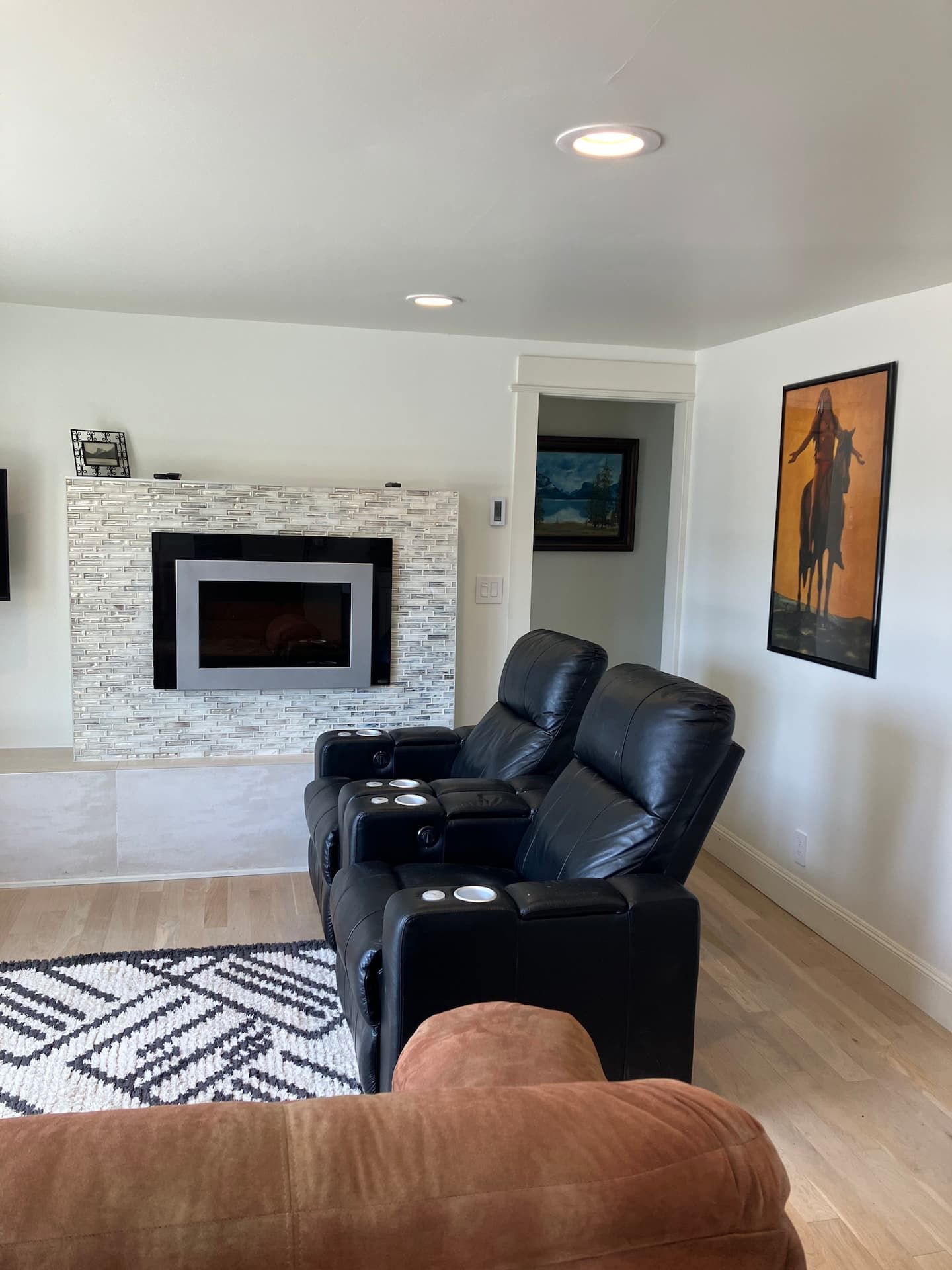 The living room, fireplace end