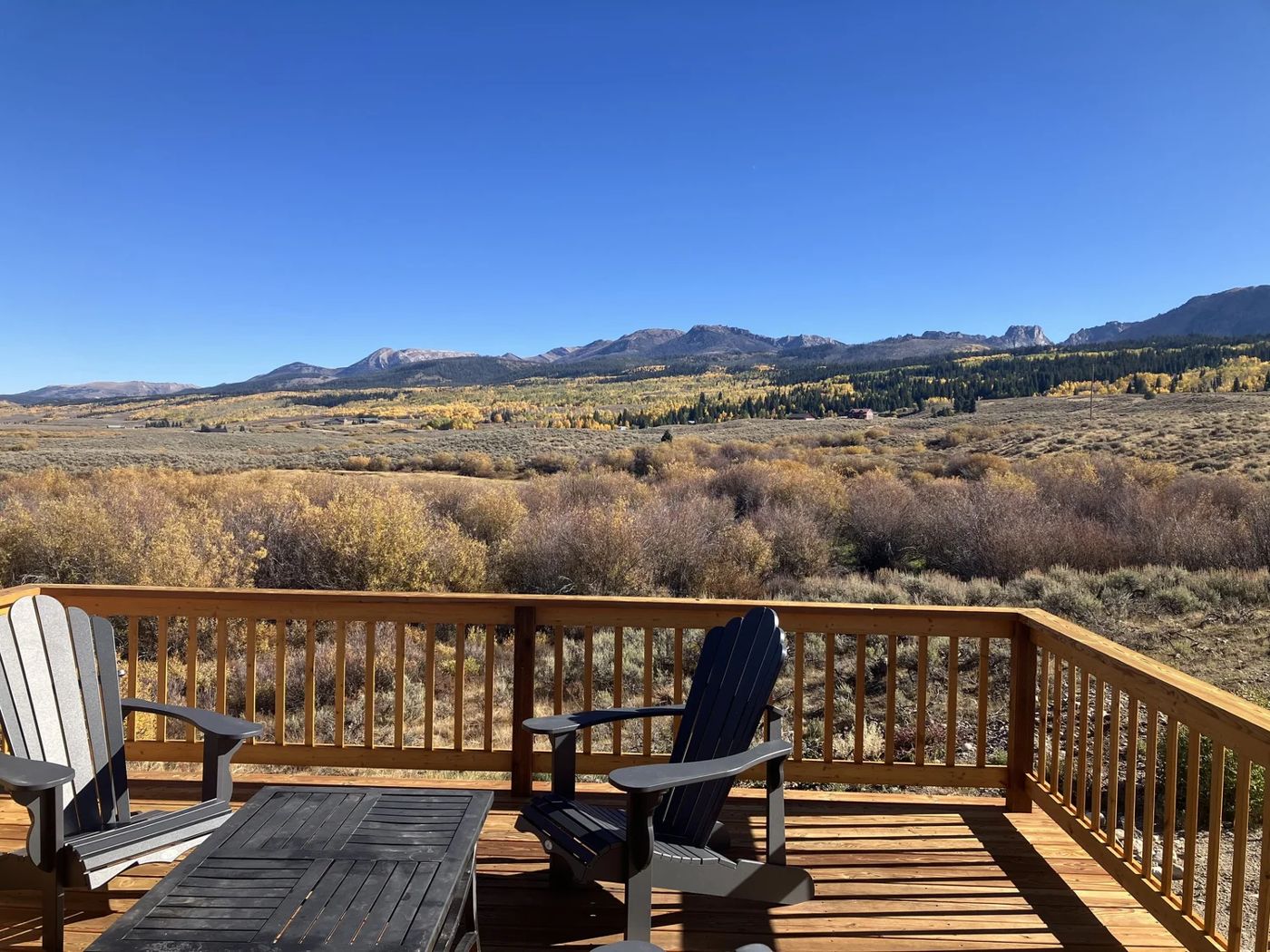 Chairs on the deck above gold aspens